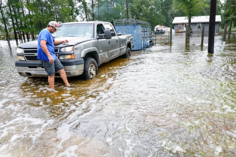 Edouard, now a tropical depression, drenches Texas with flash flooding and downed trees